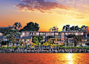 Thumbnail 1 of 16 - A row of houses are built on a rocky shore at Mariners Village, Marina del Rey, 90292