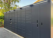 Thumbnail 10 of 16 - A long black storage unit with a door and a window at Village Pointe Apartments, Northridge, California