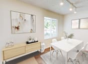 Thumbnail 3 of 12 - A white dining table with four chairs and a cabinet with a plant on top.
