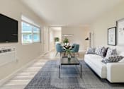 Thumbnail 7 of 13 - A living room with a white couch and a coffee table at Pleasanton Heights, California