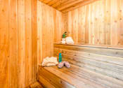 Thumbnail 12 of 13 - A wooden sauna with a bench and towels at Rancho Los Feliz, Los Angeles, California