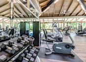 Thumbnail 13 of 13 - A gym with a variety of equipment including treadmills, dumbbells, and weight machines at Rancho Los Feliz, Los Angeles, California