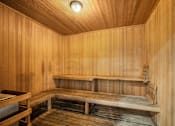 Thumbnail 22 of 34 - A wooden sauna with a bench and a light on the ceiling at Esprit Marina del Rey, 90292