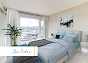 Thumbnail 12 of 24 - A bedroom with a large bed and a view of the beach at Marina Harbor, California, 90292