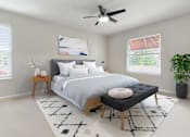 Thumbnail 9 of 17 - A bedroom with a large bed, a ceiling fan, and a rug on the floor at Valley Plaza Villages, California, 94566