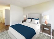 Thumbnail 9 of 16 - A bedroom with a large bed and a nightstand with a lamp at Village Pointe Apartments, Northridge, California