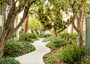 Thumbnail 3 of 16 - Lush landscaping at Village Pointe Apartments, California