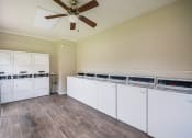 Thumbnail 18 of 27 - Laundry Room at Bookstone and Terrace Apartments in Irving, Texas