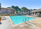 Thumbnail 10 of 27 - Main Pool at Bookstone and Terrace Apartments in Irving, Texas