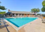 Thumbnail 9 of 27 - Main Pool at Bookstone and Terrace Apartments in Irving, Texas