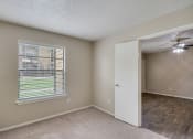 Thumbnail 15 of 27 - Master Bedroom Area at Bookstone and Terrace Apartments in Irving, Texas
