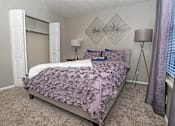 Thumbnail 9 of 37 - Ambassador bedroom in model home with closet at The Oasis apartments in Bossier City, LA