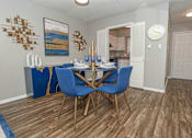 Thumbnail 7 of 37 - A dining room with a table and chairs at The Oasis apartments in Bossier City, LA