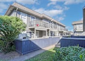 Thumbnail 17 of 37 - Walkway between apartment patios and balconies at The Oasis apartments in Bossier City, LA