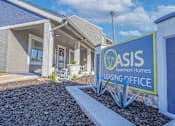 Thumbnail 18 of 37 - A sign for Oasis Leasing Office in front of the leasing office at The Oasis apartments in Bossier City, LA.