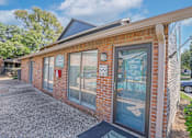 Thumbnail 6 of 23 - A brick building with a sign that says "The Pine" on it.