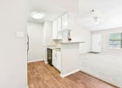 Thumbnail 21 of 27 - Terrace Unit Kitchen and Dining Room at Bookstone and Terrace Apartments in Irving, Texas