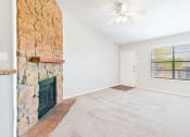 Thumbnail 20 of 27 - Carpeted Living Room at Terrace at Bookstone and Terrace Apartments in Irving, Texas