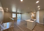 Thumbnail 9 of 13 - A kitchen area with a sink and cabinets.