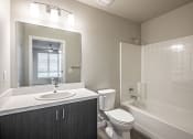 Thumbnail 19 of 21 - a bathroom with a sink toilet and bathtub
