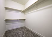 Thumbnail 16 of 16 - a small room with a carpeted floor and white walls
