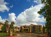 Thumbnail 3 of 28 - Marbella Entrance with Monument Sign and Gate
