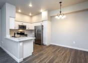Thumbnail 8 of 18 - a kitchen and living room in a house