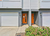 Thumbnail 2 of 16 - The image shows the front of a building with the number 203 on it.