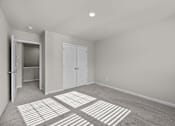 Thumbnail 20 of 29 - A room with a carpet and two doors.