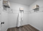 Thumbnail 40 of 49 - A white bathroom with a towel hanging on the rack.