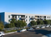 Thumbnail 50 of 50 - a white and blue building with cars parked in front of it