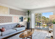 Thumbnail 1 of 20 - Living room with balcony and modern decor at Skyline at Barton Creek Apartments, Texas, 78758
