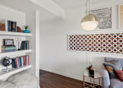 Thumbnail 6 of 20 - Living room with built in shelving and decorative panel at Skyline at Barton Creek Apartments, Austin, TX 78758