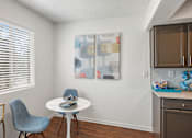 Thumbnail 5 of 20 - Breakfast nook with modern dining table at Skyline at Barton Creek Apartments, Austin, TX