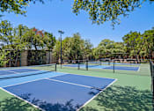 Thumbnail 19 of 20 - Tennis courts with professional surfacing at Skyline at Barton Creek Apartments, Austin