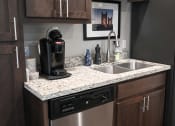 Thumbnail 11 of 16 - a kitchen with a sink and a dishwasher