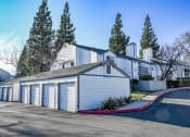Thumbnail 2 of 16 - a row of garages in front of a house