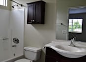 Thumbnail 14 of 18 - Bathroom with modern fixtures and storage