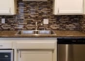 Thumbnail 13 of 23 - a kitchen with a sink