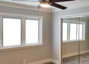 Thumbnail 12 of 23 - a living room with a ceiling fan