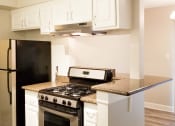 Thumbnail 8 of 23 - a kitchen with white cabinet