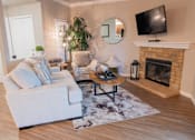 Thumbnail 52 of 54 - a living room with a fireplace and a tv