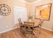 Thumbnail 49 of 54 - a dining room with a table and chairs and a large clock