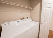 Thumbnail 54 of 54 - a washer and dryer in a laundry room with a closet