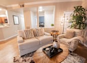 Thumbnail 46 of 54 - a living room with a couch and a coffee table