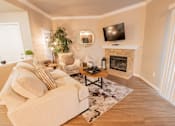 Thumbnail 44 of 54 - a living room with a couch and a fireplace and a tv