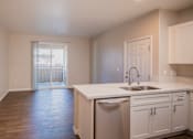 Thumbnail 56 of 61 - A kitchen with white cabinets and a stainless steel dishwasher.
