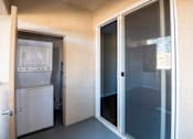 Thumbnail 52 of 61 - A white refrigerator is in a kitchen with a door open.