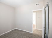 Thumbnail 50 of 61 - A room with white walls and a carpeted floor.