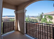Thumbnail 61 of 61 - A balcony with a metal railing and a view of the outdoors.